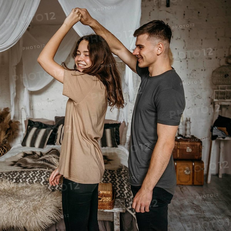 Adorable young couple dancing together