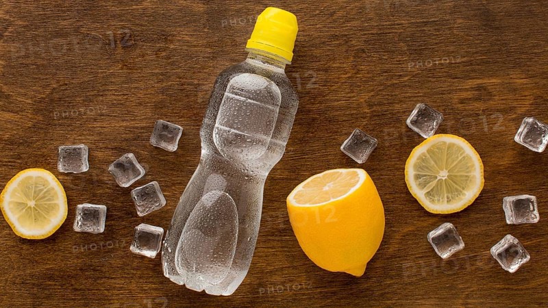 Plastic bottle water lemon top view