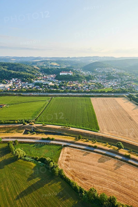 Aerial view over the fields and forests to the castle in Woerth an der Donau