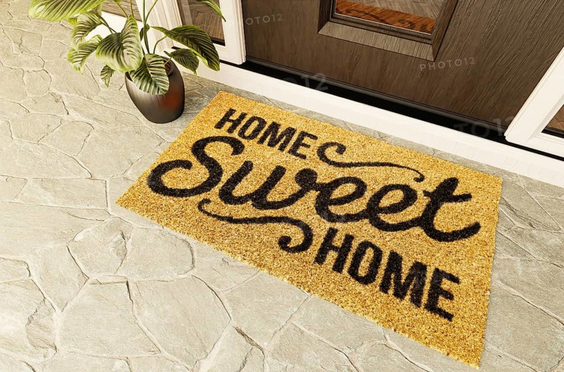 Home sweet home doormat on the porch at the front door