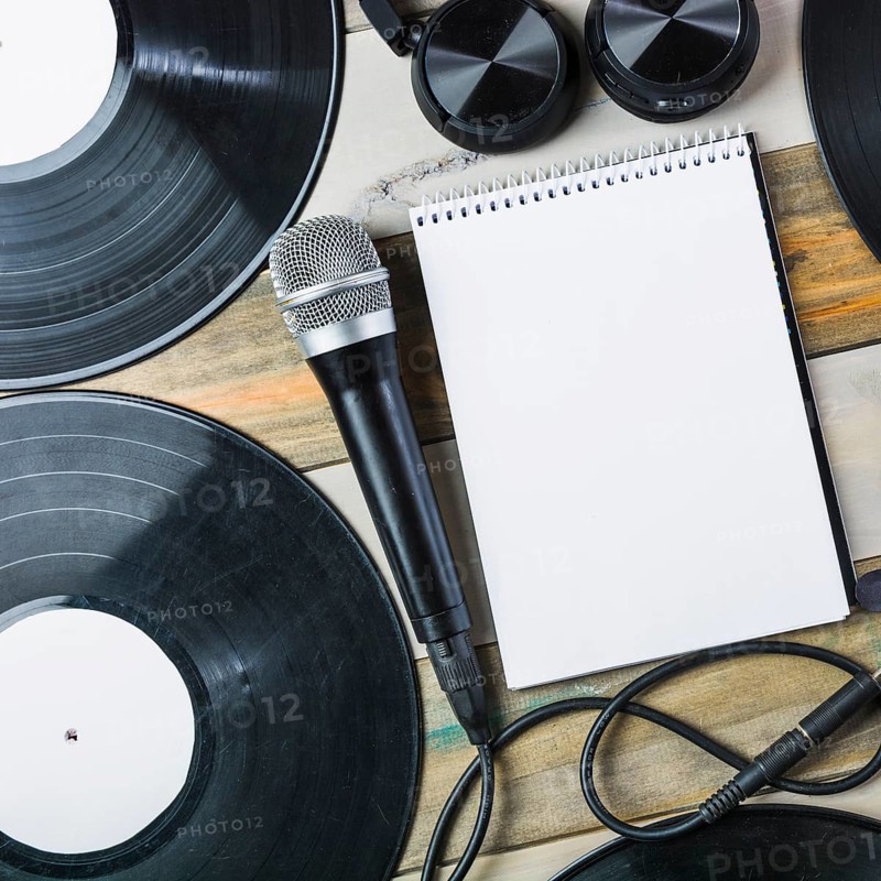 Headphone microphone vinyl record blank spiral notepad wooden table