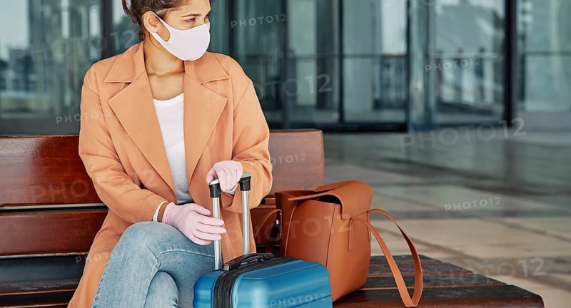 Woman with gloves medical mask airport during pandemic