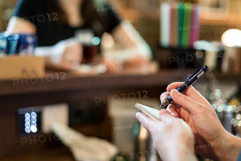 Crop hands taking order