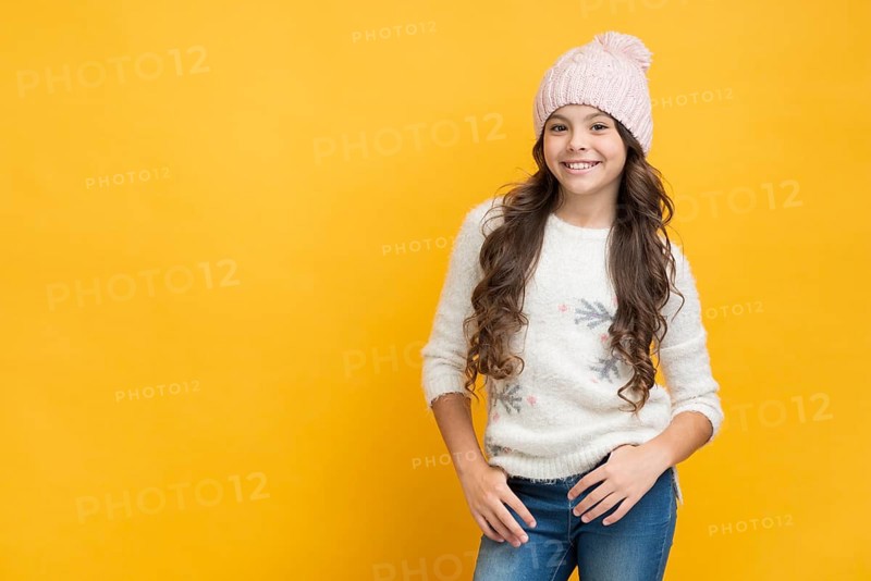 Smiling girl sweater with snowflakes