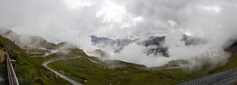 Morning fog drifts over a mountain ridge