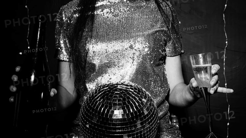 Lady with disco ball bottle glass