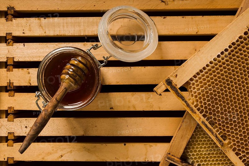 Top view glass jar full honey