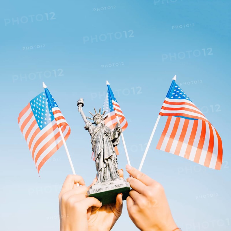 Hands waving american flags