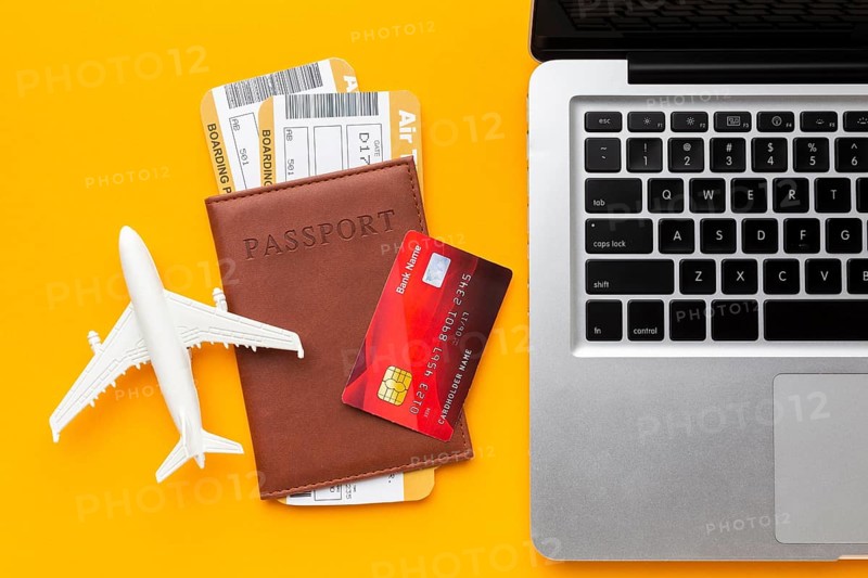 Top view passport laptop arrangement