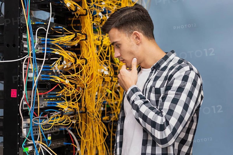 Young network engineer server room medium shot