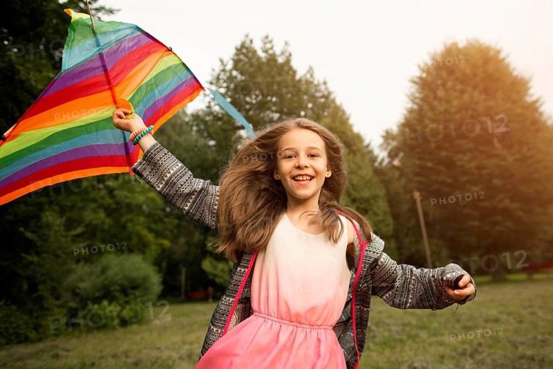 Front view beautiful happy girl with kite