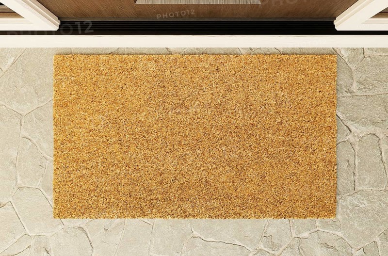 Overhead of blank doormat on the porch at the front door