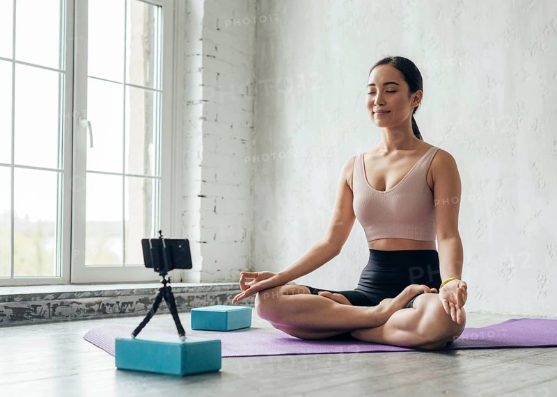 Young woman showing meditation technique new vlog