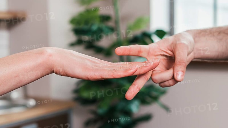 Close up couple playing rock paper scissors game