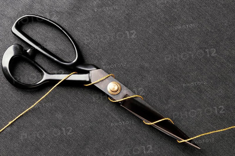 Scissors with thread top view