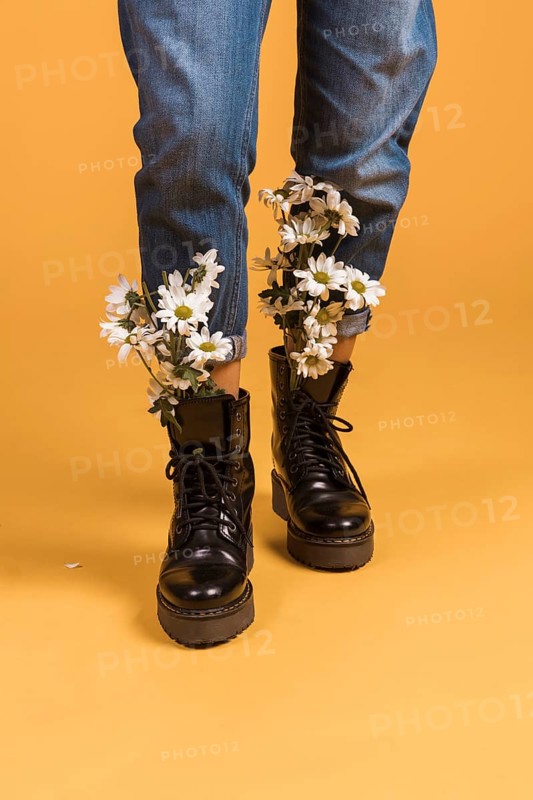 Woman legs with flowers shoes