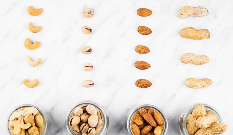 Fresh nut food jar marble surface