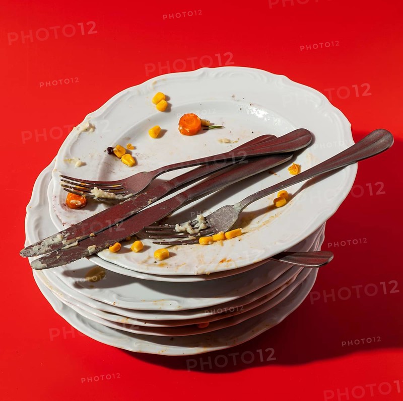Pile plates with leftovers high view