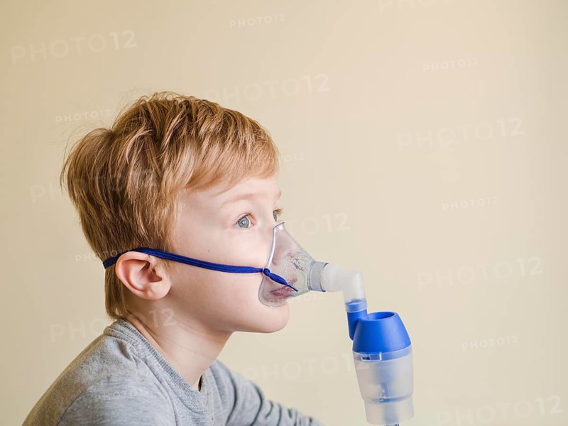 High angle boy with oxygen mask