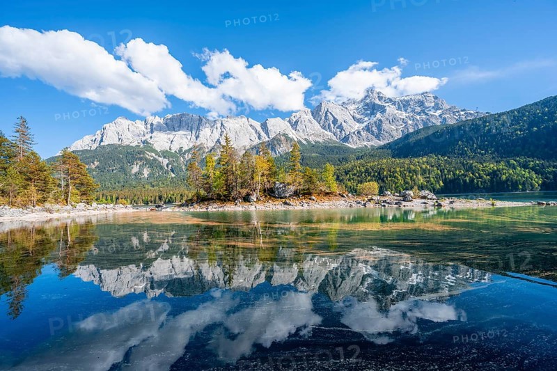 Zugspitze massif and Zugspitze reflected in Eibsee lake