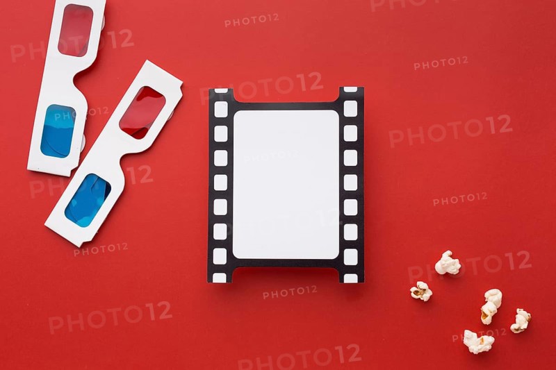 Top view arrangement movie elements red background