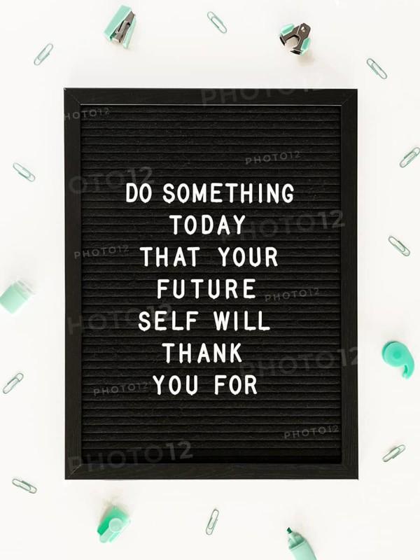 Black motivational text board flat lay