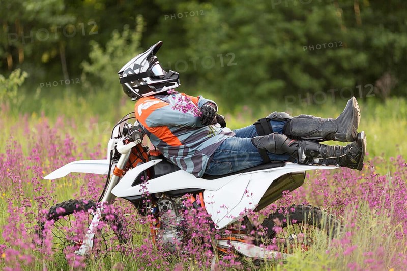 Stylish man relaxing top motorbike