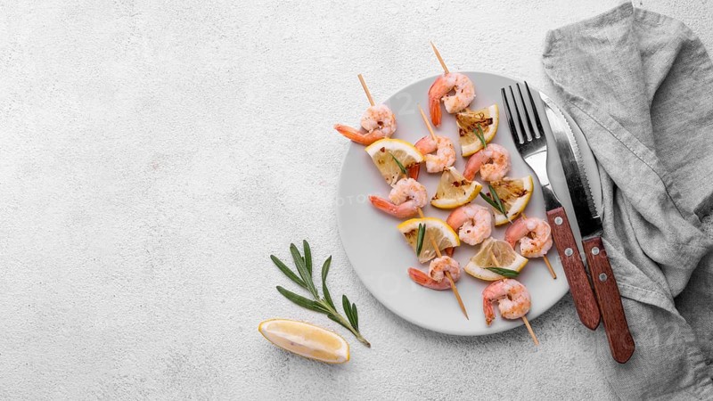 Fresh seafood shrimp skewers cutlery