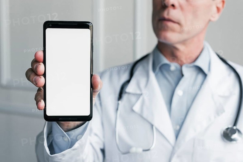 Doctor showing mobile phone