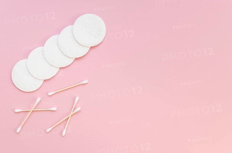 Flat lay arrangement with cotton pads ear sticks