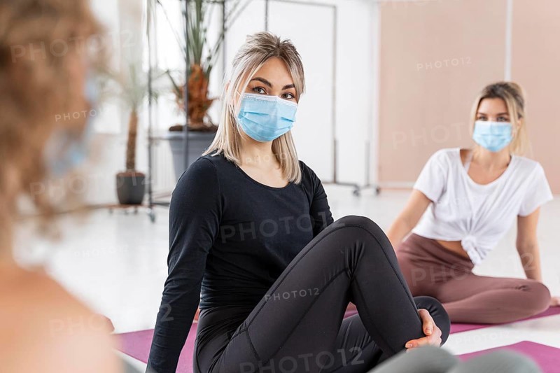 Close up women wearing masks
