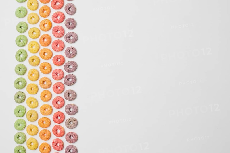 Flat lay frame with colorful cereals copy space