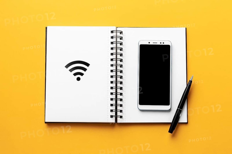 Top view wi fi symbol with notebook smartphone