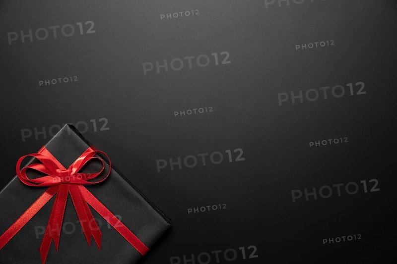 Wrapped black gift with copy space