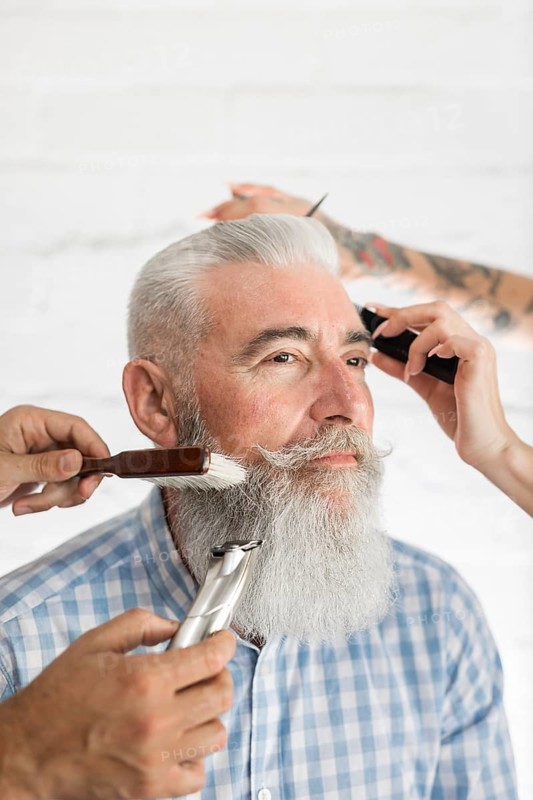 Senior customer getting beard hair care