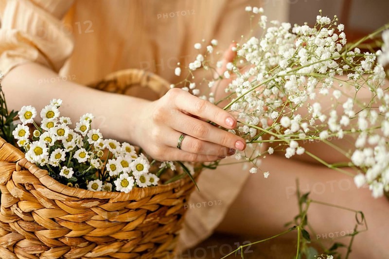 Woman with basket spring flowers