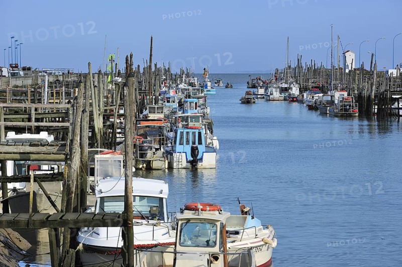 Fishing boats and oyster farming boats in the harbour Port du Bec near Beauvoir-sur-mer