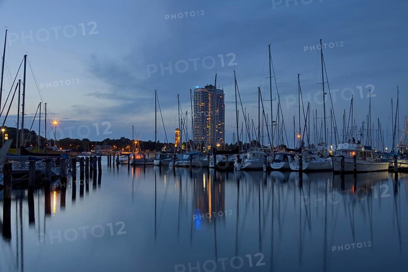 The Maritim Hotel and sailing boats in marina at dusk