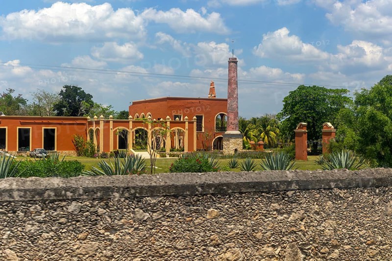 View from bus window of former henequen estate buildings of Hacienda Kinchil