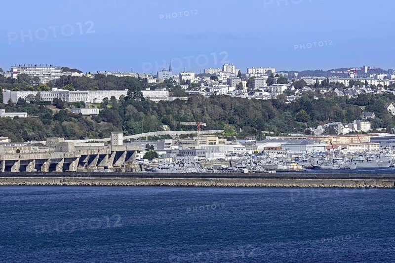 View over German WW2 U-boat submarine pen and French Navy ships docked in the port