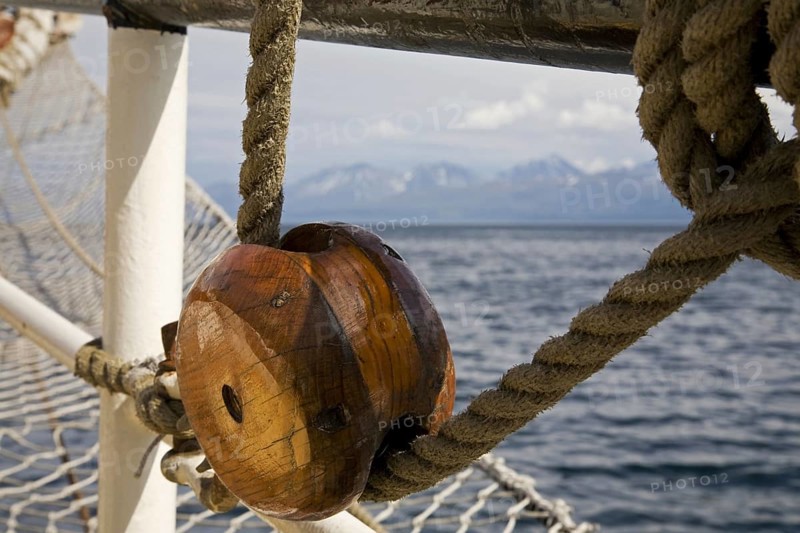 Wooden pulley on board of the tall ship