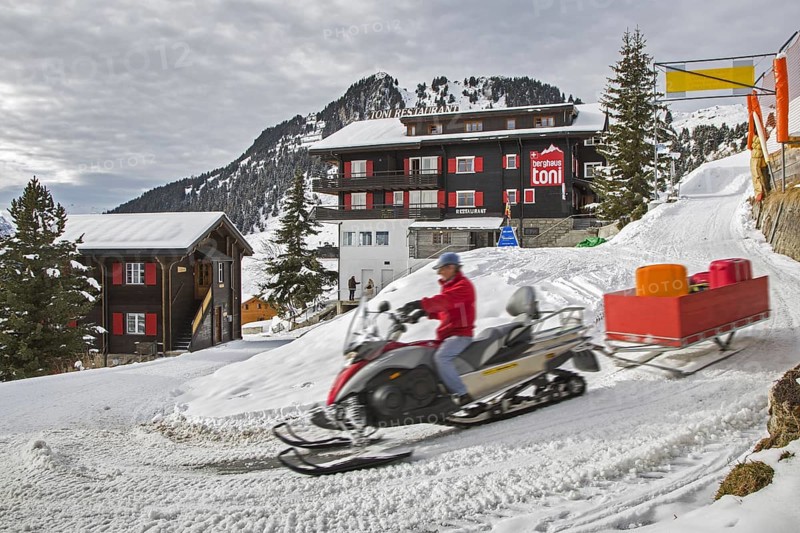 Man on snow scooter
