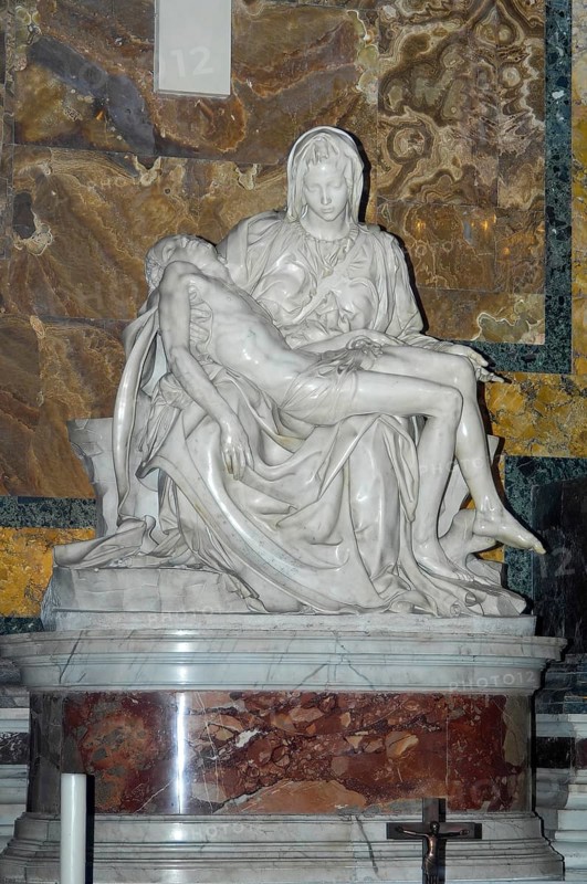 Frontal view of marble sculpture Sculpture in white marble from Carrara Pieta by Michelangelo Mary Mother of God mourns holds son