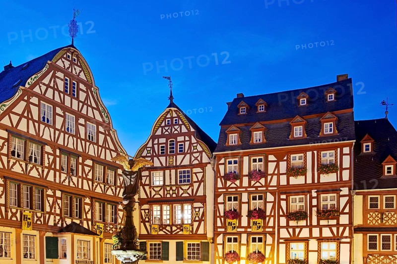 Gabled half-timbered houses on the medieval market square in the evening