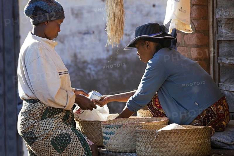 Malagasy woman buying groceries ant weekly market in the city Ambalavao