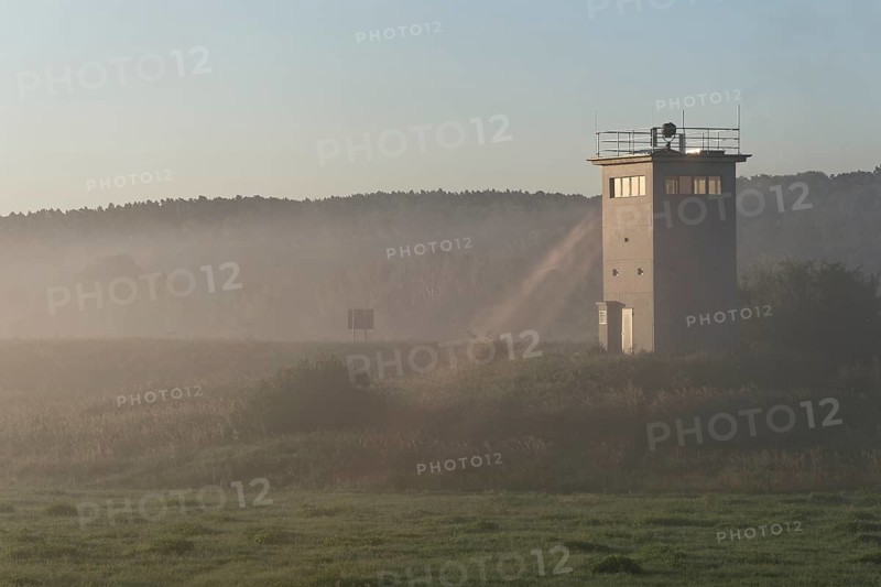 Former GDR border tower in the early morning mist in the Elbe floodplain near Darchau in the Elbe River Landscape UNESCO Biosphere Reserve. Amt Neuhaus