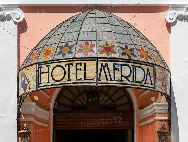 Stained glass canopy entrance to colonial style Hotel Merida