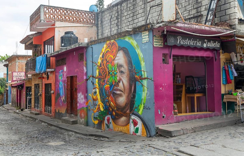 Mural painted on wall pf pasteleria shop on corner of street Tepoztlan
