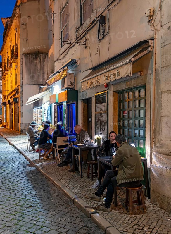 Outdoor restaurant in Alfama by night