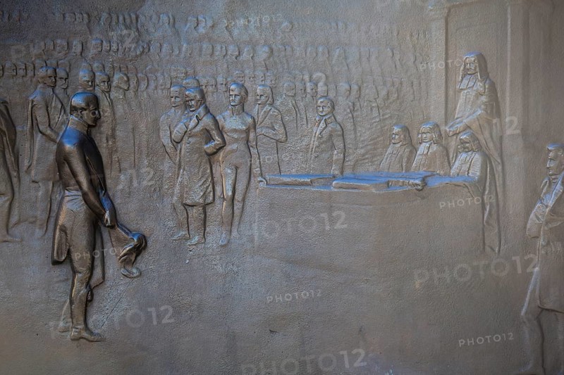An engraving on the Wellington Monument shows The Duke of Wellington receiving gratitude before the House of Commons in 1814. Picadilly